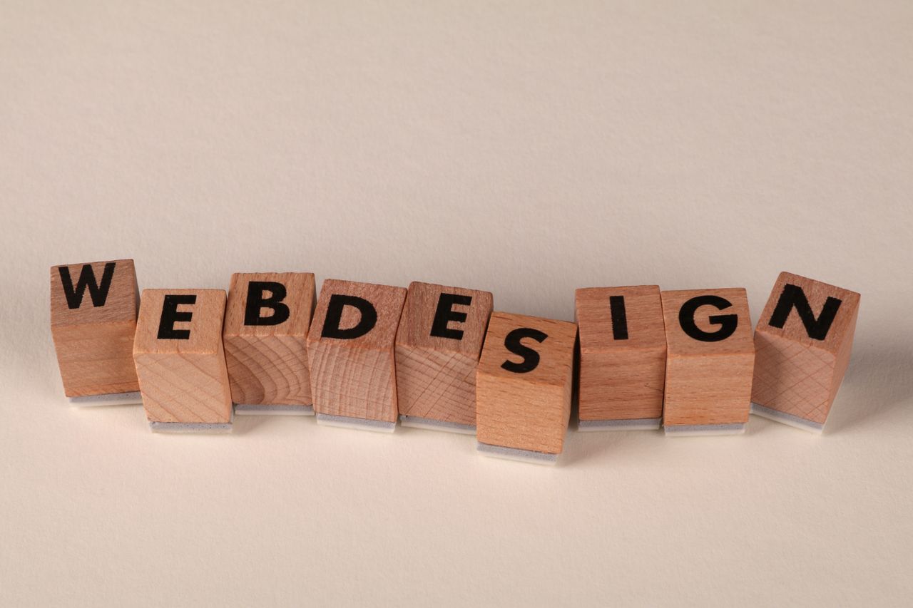 services-03 Wooden blocks spelling web design creatively showcase digital design concept.
